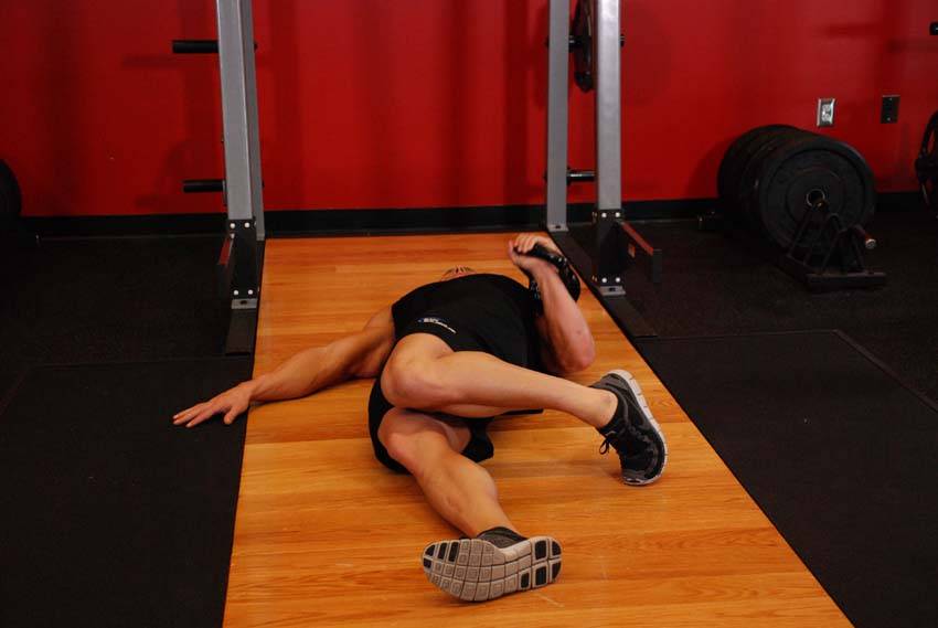 Extended Range One-Arm Kettlebell Floor Press demonstration
