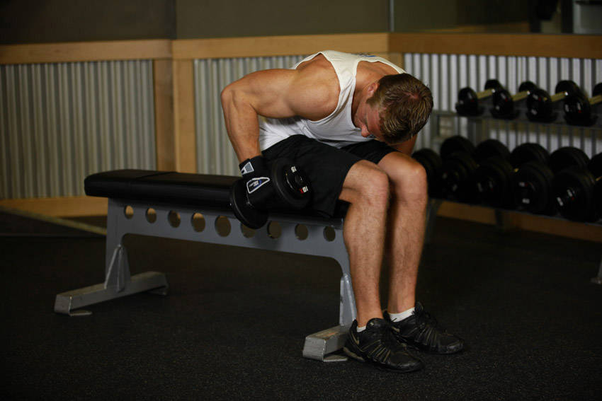 Seated Bent-Over One-Arm Dumbbell Triceps Extension demonstration